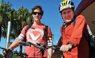 A wheel of a good time: Simon Williams and Simon Waterworth enjoy a sunny ride to work yesterday. A wheel of a good time: Simon Williams and Simon Waterworth enjoy a sunny ride to work yesterday.